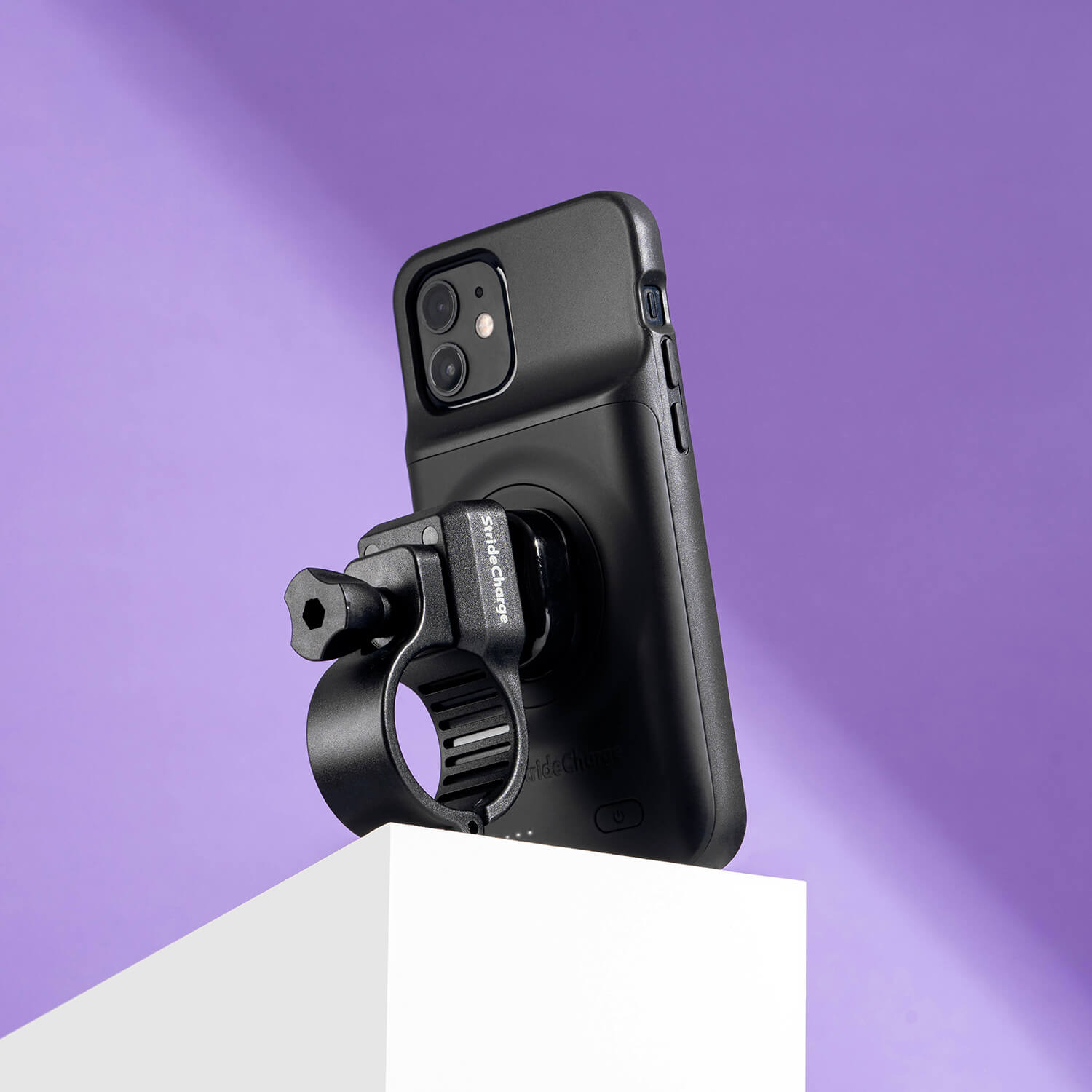 Back side view of the StrideCharge Mount attached to the Stride Charge Case on a white pedestal