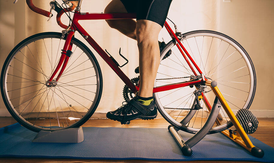 A cyclist on an indoor bike trainer